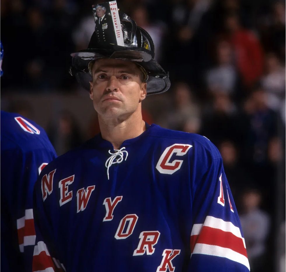 Mark Messier in a New York firefighter's helmet at Madison Square Garden