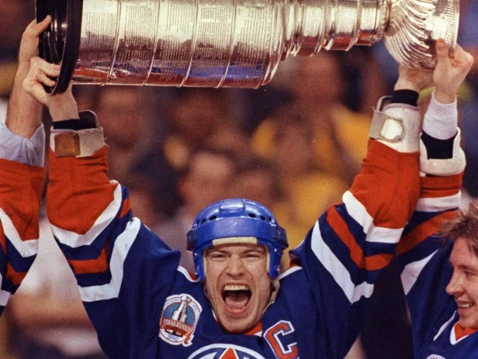 Mark Messier lifting the Stanley Cup as captain of the Edmonton Oilers