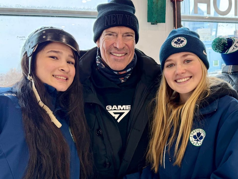 Mark Messier with two North Park players at the rink